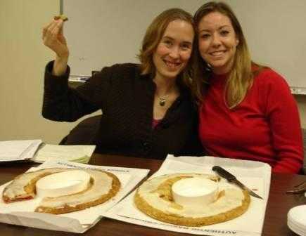 Harvard graduate students, Rebecca Lincoln and Melissa Ekstrand enjoy Kringle bread, which is native to Racine, Wisconsin.