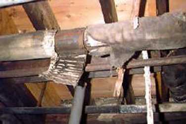 Figure 12.6. Heating Ducts Covered With Asbestos Insulation