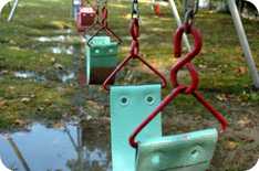 Row of swings on a playground