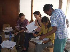 Photo: CDC staff reviewing patient charts during the cholera epidemic in Haiti
