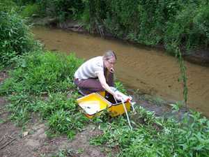 Water sample collection during an investigation of cryptosporidiosis at a summer camp