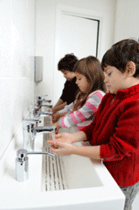 Children washing their hands at school.