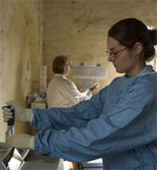 Woman wearing protective clothing in a medical facility
