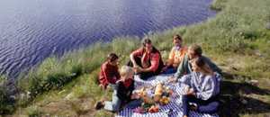 Thumbnail of people having a picnic by the water