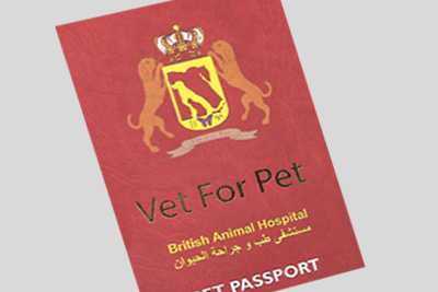 Cropped image of a red passport book an official-looking emblem featuring pets and a crown 