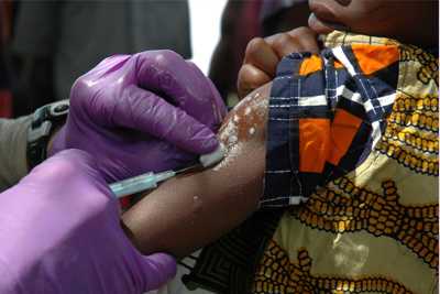 image of an African child receiving a vaccination