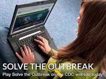 An image of a woman playing the Solve the Outbreak app on a laptop.