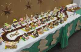 picture of gingerbread houses and MEC trailer made of cake