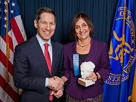 Photo: Lucia Tondella, Chief, DBD Pertussis and Diphtheria Laboratory, accepts the Excellence in Program Delivery, International award from CDC Director Tom Frieden