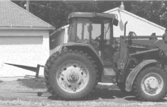 Photo 2: tractor with rear and bale spear