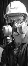 didsaster worker wearing hard hat and respirator