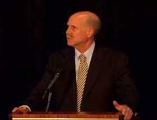 image of Dr. John Howard at the podium