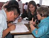 3 people conducting an assessment