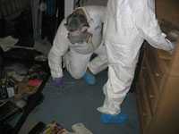 NIOSH workers sample methamphetamine levels in a former clandestine lab.