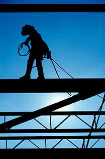 	silhouette of a person on a construction site