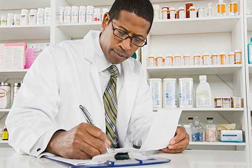 male pharmactist working in pharmacy
