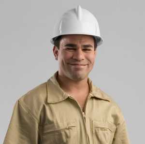 A Hispanic construction worker smiles with satisfaction