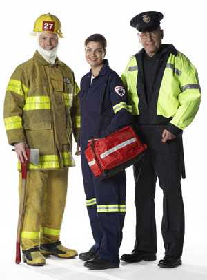 Fireman, policeman, and paramedic posing together