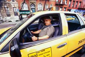 	Taxi driver in his vehicle
