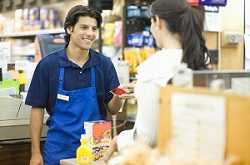 	Grocery worker talking to customer