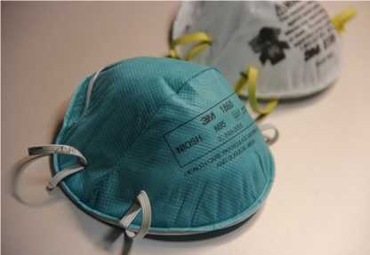 The NIOSH-certified N95 filtering facepiece respirator protects against particulates. Photo from Debora Cartagena, Centers for Disease Control and Prevention.