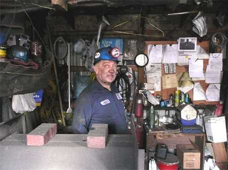 Bill Reiner, a 70-year-old coal miner in Joliett, Pennsylvania, stands in his miner's shanty surrounded by his repertoire of mining paraphernalia in March 2008. Photo by Anita L. Wolfe, CDC/NIOSH
