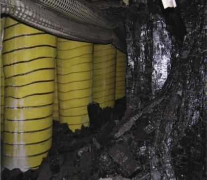 Pumpable roof supports, shown above in an underground coal mine, stabilize the mine roof to prevent collapse during coal removal. Photo from NIOSH.