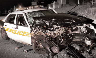 a police cruiser, photographed after being involved in a frontal collision.