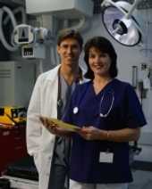 	nurse and physician posing with documents