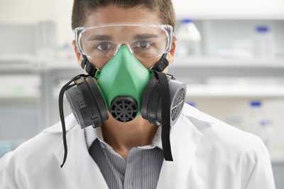 	Lab worker wearing a respirator.