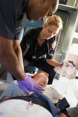 	Paramedics performing CPR on a patient.