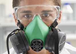 	Lab worker wearing a respirator.