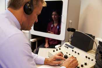 	Image showing an audiologist administering a hearing test