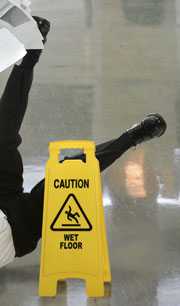 	Caution, wet floor sign with person falling.