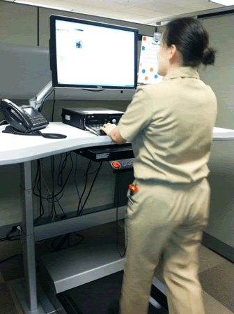 woman using a standing desk