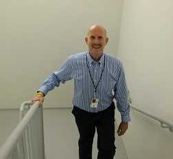 Dr. Howard walking the stairs at work