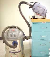 	Attaching a regular shop vacuum to a dust-collecting circular saw
