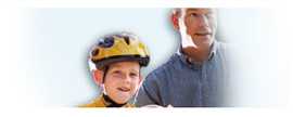 Graphic of child with a helmet riding his bike next to his father.