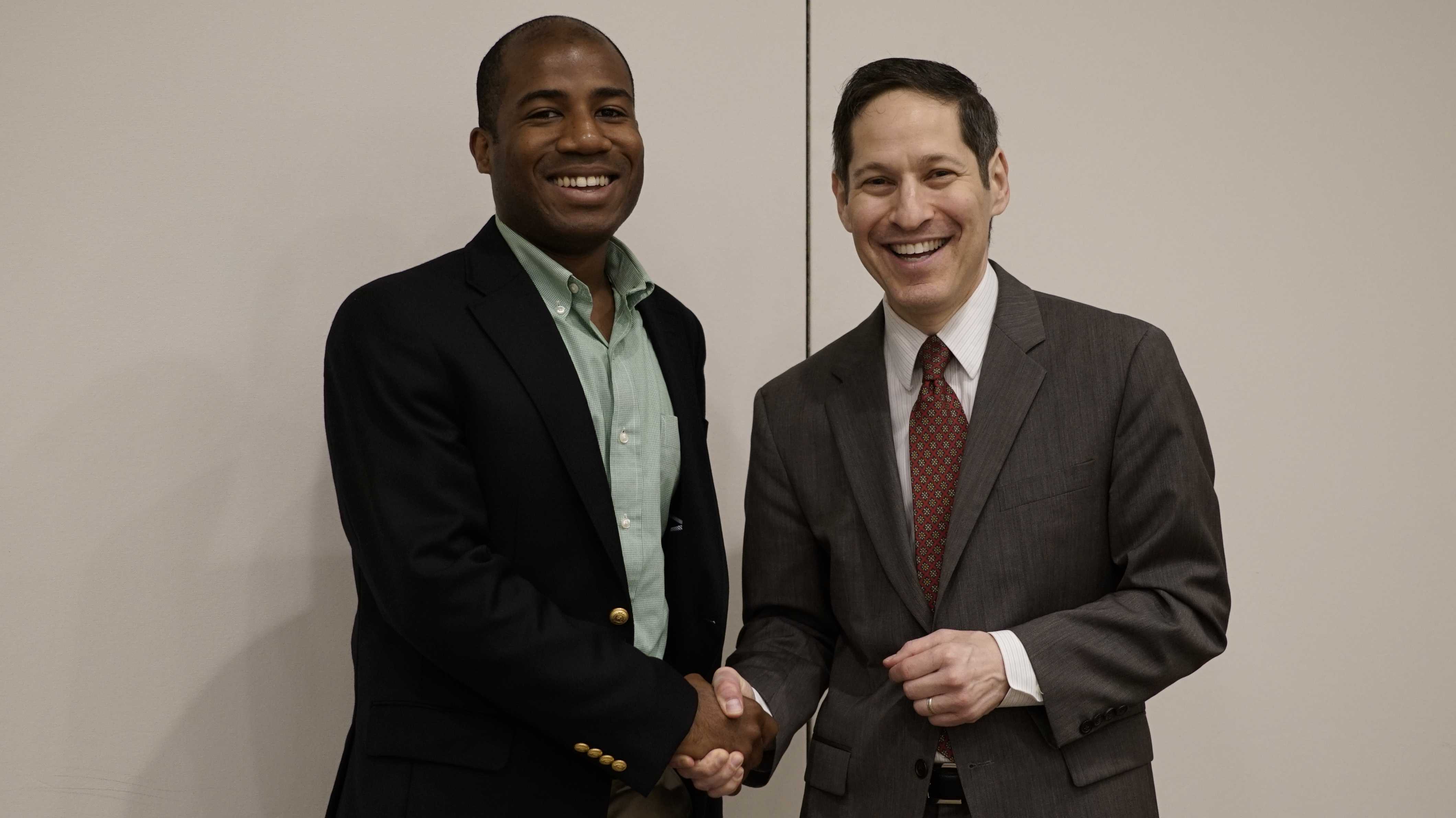 Roberto shakes hands with CDC Director Dr. Tom Frieden while acting as his on-the-ground control officer in Puerto Rico.