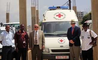 Men in front of an medical vehicle