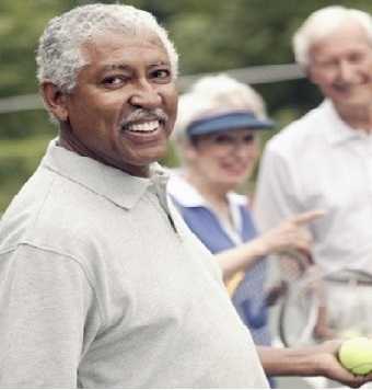 older adults playing tennis