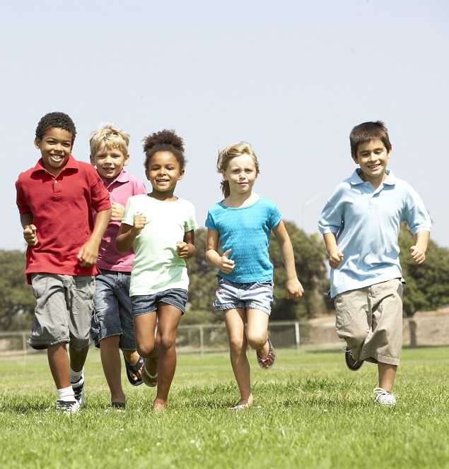 Group of children running in a field