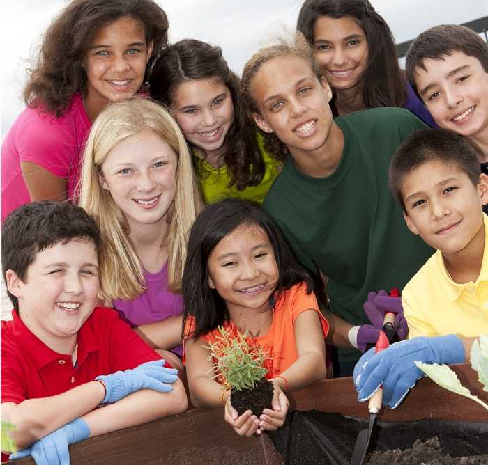 Group of children planting a garden