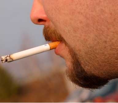 Image of a man smoking a cigarette