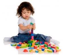 Photo: child playing with blocks