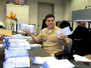 A public health officer reviewing paperwork.