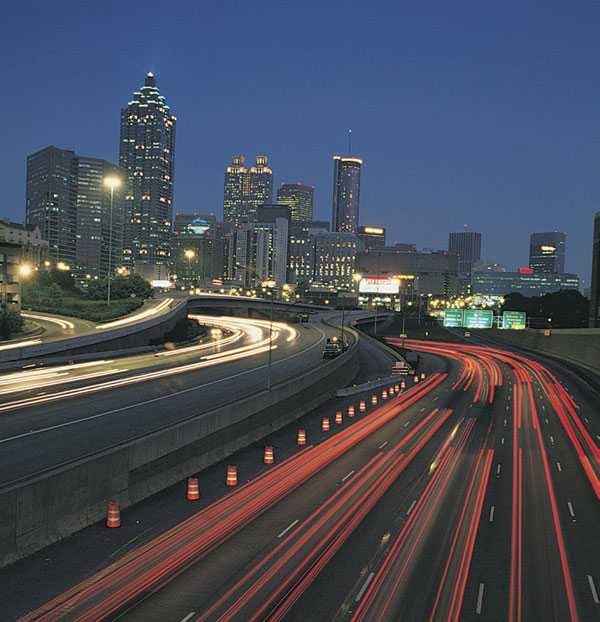 Atlanta's skyline and busy highway at night.