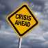 image of a sign stating "crisis ahead"