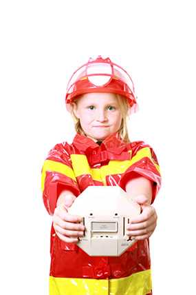 	photo: girl holding smoke detector