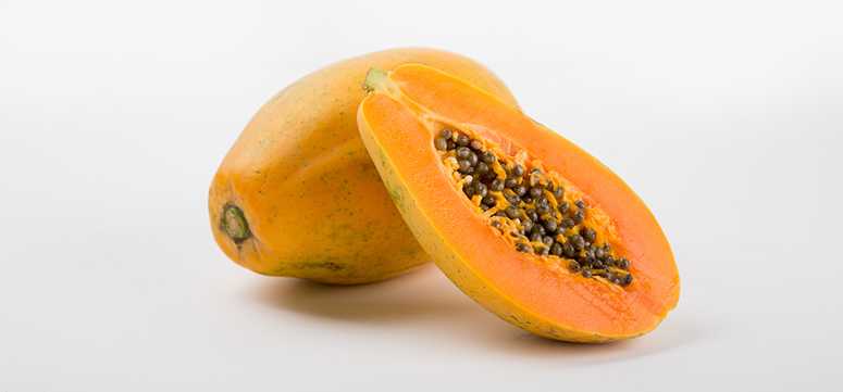 Photo of a papaya cut open.